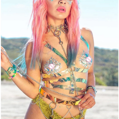 A woman wearing holographic body harness for raves or music festivals.