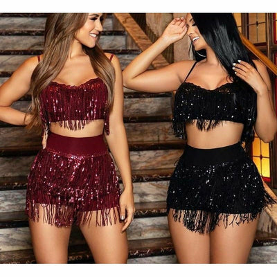 A rave girl wearing red sequin fringe two piece set and another rave girl wearing black sequin fringe two piece set.