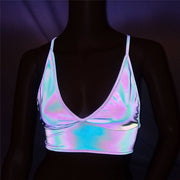 A rave girl wearing reflective crop top for raves or music festivals.