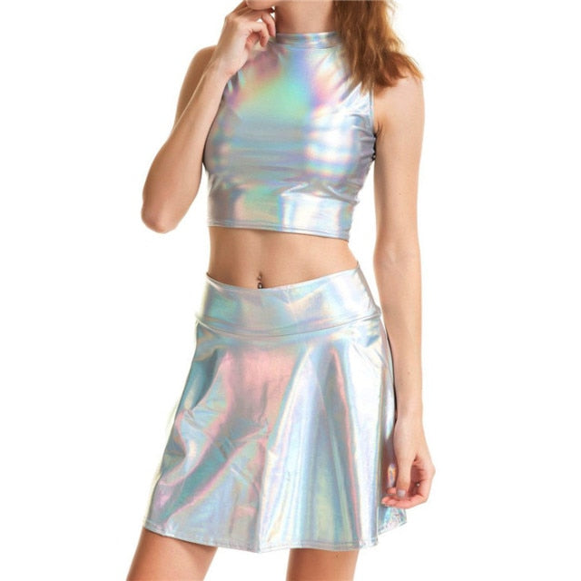 A rave girl wearing holographic turtleneck top and holographic skirt to a rave or music festival.