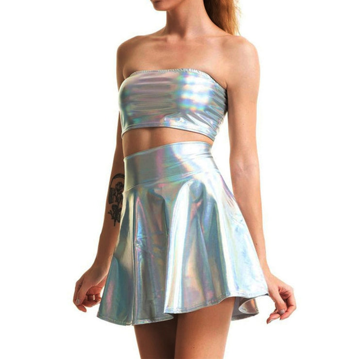 A rave girl wearing holographic tube top and holographic skirt to a rave or music festival.