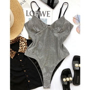 One piece sparkly grey swimsuit for raves.