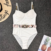 One piece white bikini with leopard belt for raves.