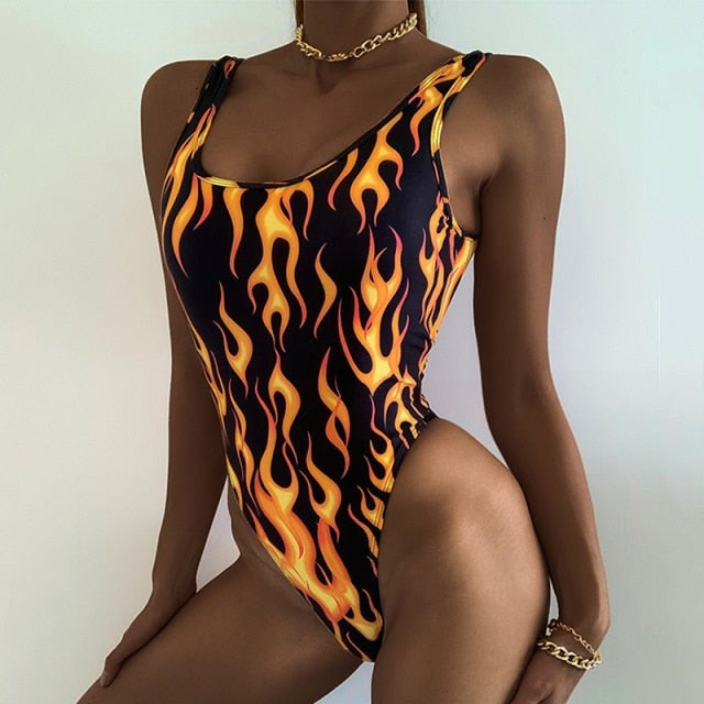 A rave girl wearing flames print one piece swimsuit for raves.