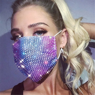 A rave girl wearing purple sequin face mask to a music festival.