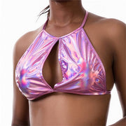 A rave girl wearing pink holographic crop top to a rave or music festival.