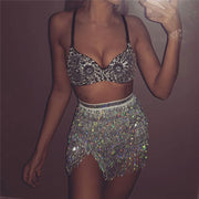 A rave girl wearing silver sparkly sequin two piece set for raves.