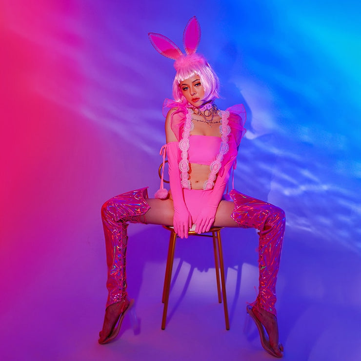 A rave girl wearing pink bunny rave costume with wigs.