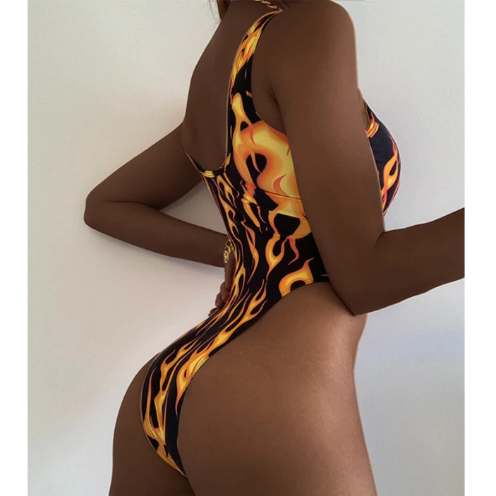 A rave girl wearing flames print one piece swimsuit for raves.