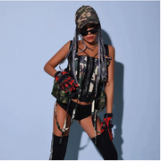 A rave girl wearing camouflage military rave two piece set with cap wig.