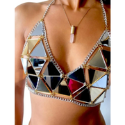 A woman wearing gold handmade metallic bikini top for raves.