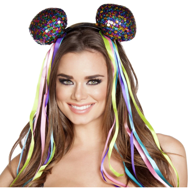 A woman wearing colorful sequin head piece for raves or music festivals.
