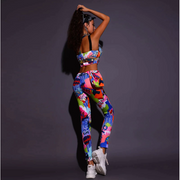 A rave girl wearing graffiti print two piece set to a music festival or rave.