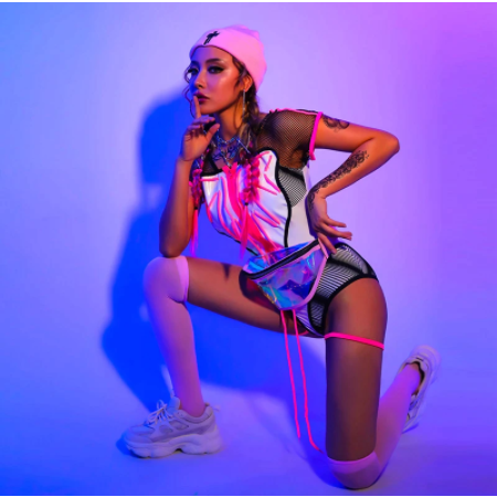 A rave girl wearing futuristic pink rave outfit with accessories.