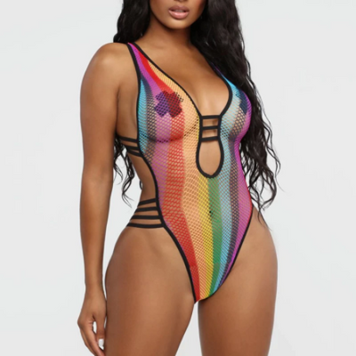 A woman wearing see through fishnet one piece bikino for raves.